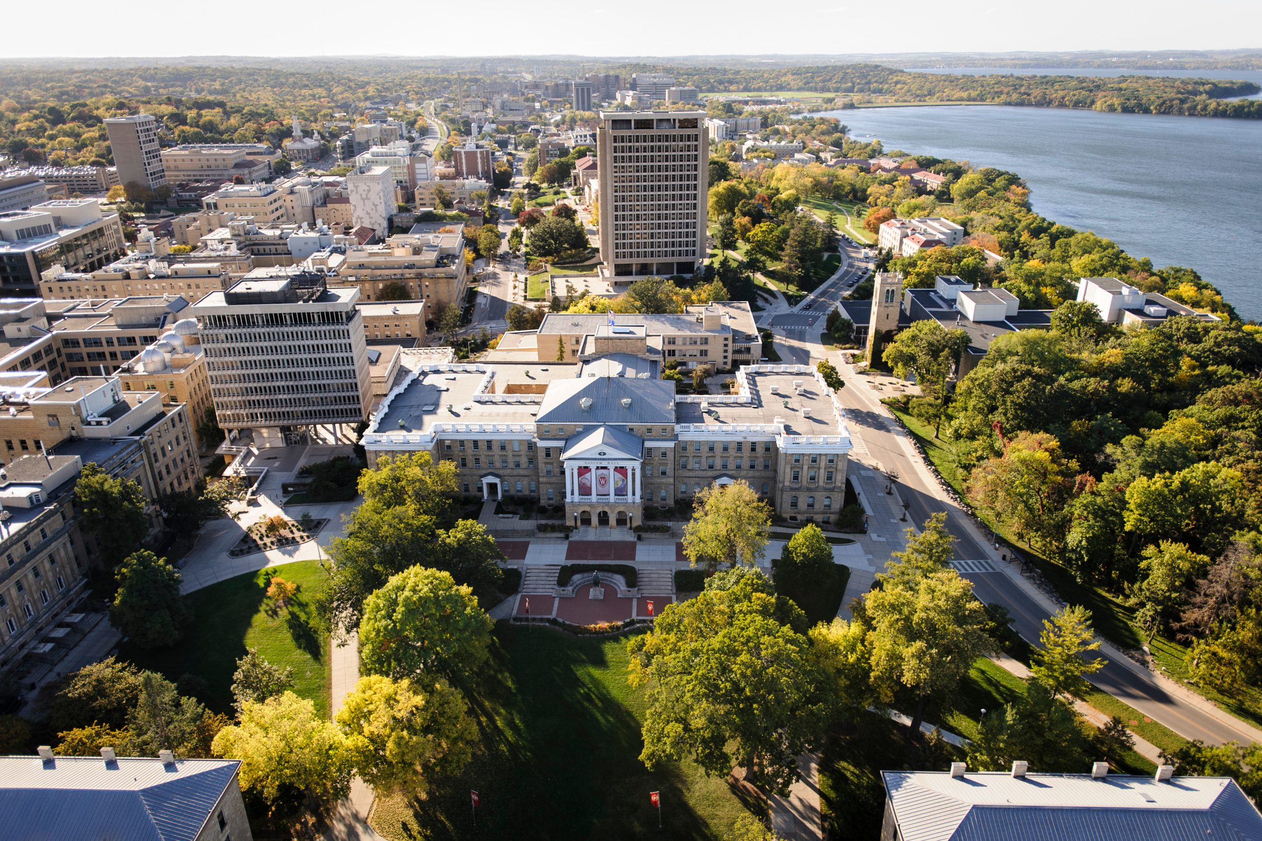 Arial major campus facilities include South Hall, Birge Hall, Van Vleck Hall, Van Hise Hall, Carillon Tower and North Hall. In the background at right is Lake Mendota. The photograph was made from a helicopter looking west.